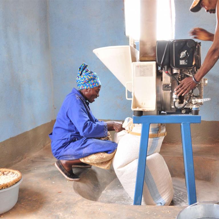 Woman is working with a Jehmlich Corn Milling Machine
